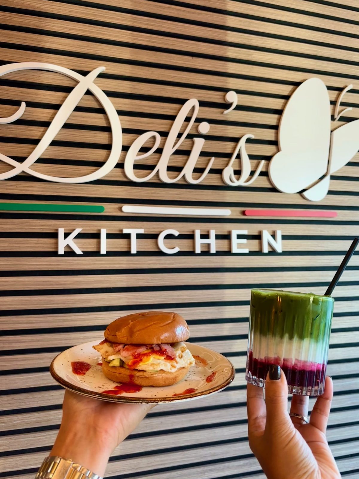 Breakfast roll and colourful drink at Deli's Kitchen