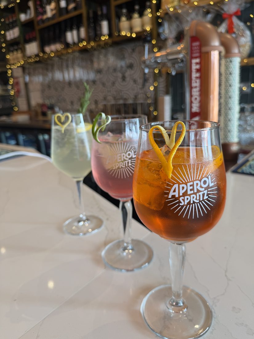 Aperol Spritz cocktails at the bar in Deli's Kitchen